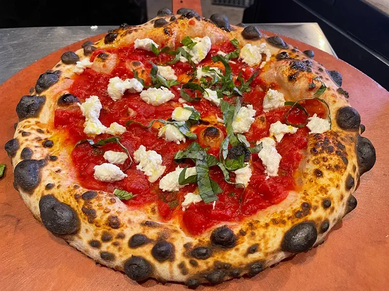 A Neapolitan pizza with "aggressive" leoparding / charring