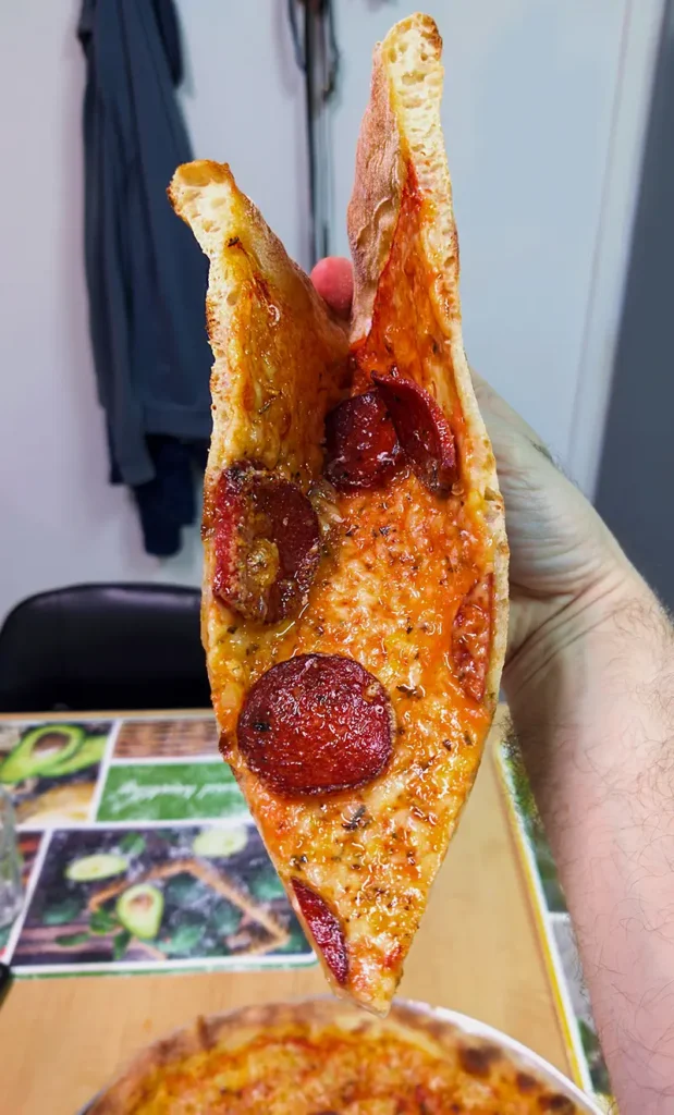 A new york pizza pepperoni slice