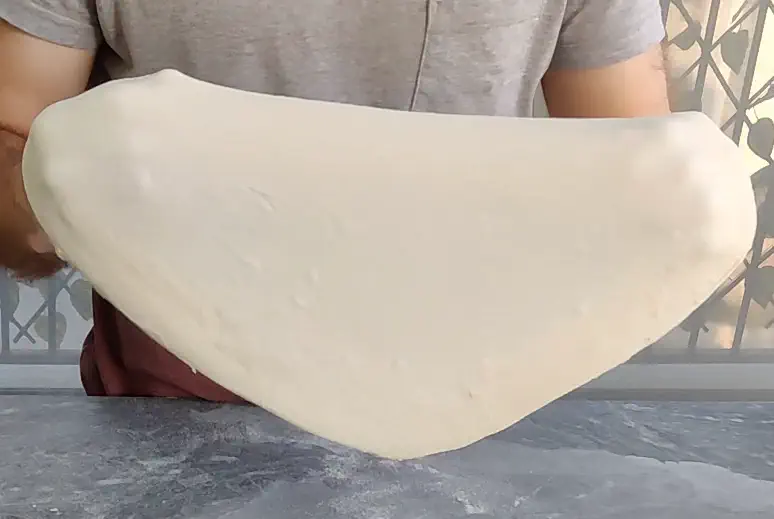 An illustration of an extensible dough being stretched