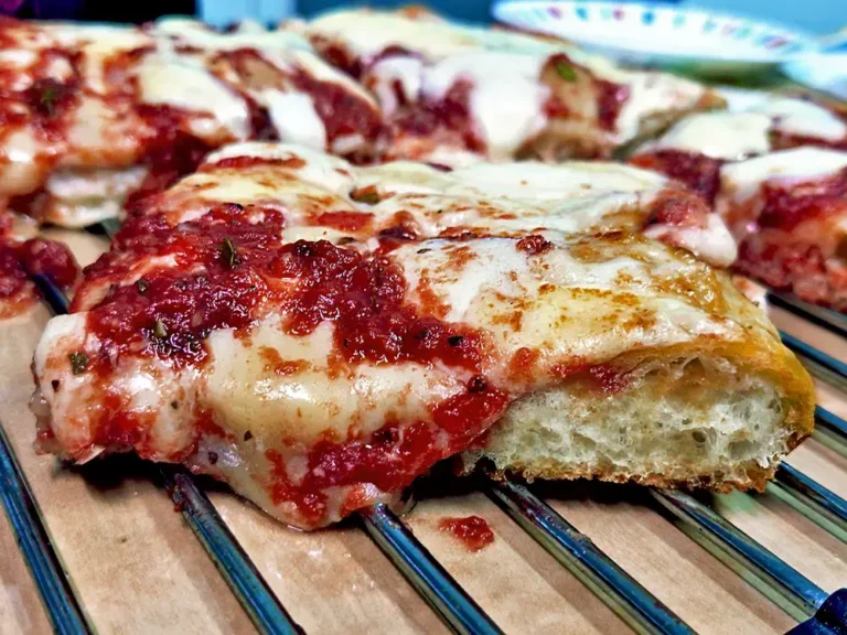 A square slice of Sicilian pizza