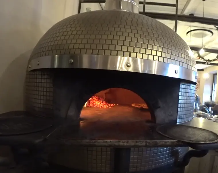 A picture of a traditional Neapolitan wood-fired pizza oven at Diego Vitagliano pizzeria