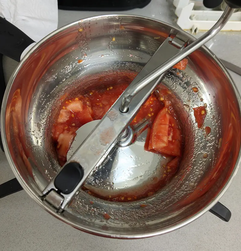 Whole tomatoes processed using a food mill