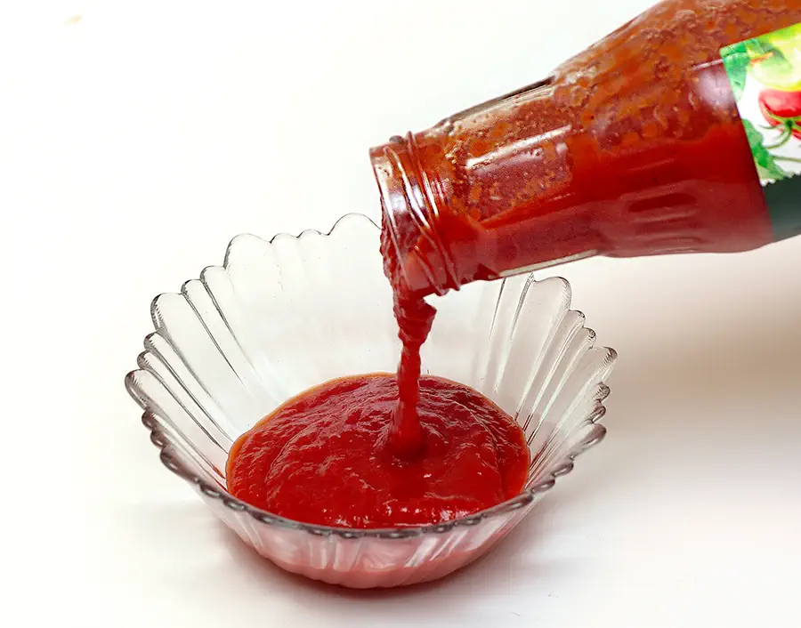 Tomato puree (passata) poured into a bowl